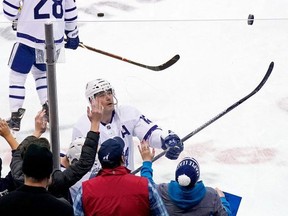Patrick Marleau of the Toronto Maple Leafs tosses a puck over the glass to a fan prior to the start of the game against the Columbus Blue Jackets on Nov. 23, 2018 at Nationwide Arena in Columbus, Ohio.