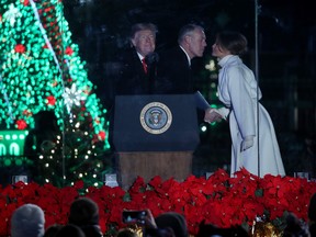 Secretary of the Interior Ryan Zinke greets First Lady Melania Trump after introducing President Donald Trump during the National Christmas Tree lighting ceremony held by the National Park Service at the Ellipse near the White House on November 28, 2018 in Washington, D.C. This is the 96th annual National Christmas Tree Lighting Ceremony. (Mark Wilson/Getty Images)