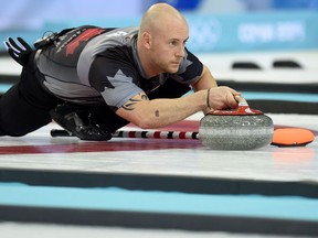 Canada's Ryan Fry throws the stone during the Men's Curling Gold Medal Game between Canada and Great Britain at the Ice Cube Curling Center in Sochi during the Sochi Winter Olympics on February 21, 2014. - Olympic gold medallist Ryan Fry was among a group of four curlers thrown out of a tournament in Canada for "extreme drunkenness", reports said November 19, 2018. Fry, who won gold for Canada at the 2014 Winter Olympics in Sochi, was tossed out of the Red Deer Curling Classic along with Jamie Koe, DJ Kidby and Chris Schille for "unsportsmanlike behaviour," several reports said.