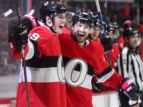 Ottawa Senators winger Drake Batherson (left) celebrates his first NHL goal with teammate Mikkel Boedker on Thursday night.