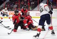 Florida Panthers centre Aleksander Barkov (right) blasts the puck past Ottawa Senators goaltender Craig Anderson as defenceman Cody Ceci and Zack Smith on Monday night. (THE CANADIAN PRESS)