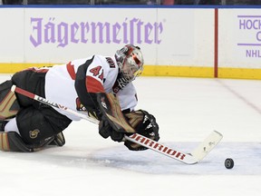 Ottawa Senators goaltender Craig Anderson dives after the puck during Monday's game against the Rangers. (AP PHOTO)