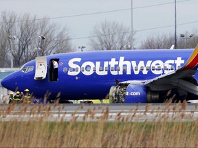 In this April 17, 2018, file photo a Southwest Airlines plane sits on the runway at the Philadelphia International Airport after it made an emergency landing in Philadelphia. (David Maialetti/The Philadelphia Inquirer via AP)