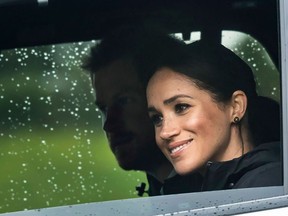 Britain's Prince Harry and his wife Meghan, Duchess of Sussex arrive for the unveiling of a plaque dedicating 20 hectares of native bush to the Queen's Commonwealth Canopy project at The North Shore Riding Club in Auckland on October 30, 2018.