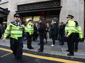 Police officers are seen outside the office building housing Sony Music's offices in London on Nov. 2, 2018 after an incident that resulted in one arrest after two people were stabbed. (DANIEL LEAL-OLIVAS/AFP/Getty Images)