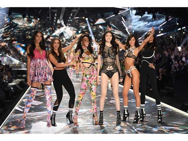 (From L) Models Yasmin Wijnaldum, Barbara Palvin, Winnie Harlow, Sui He, Bella Hadid, and Lameka Fox walk the runway at the end of the 2018 Victoria's Secret Fashion Show on Nov. 8, 2018 at Pier 94 in New York City.