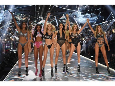 (From L) Models Taylor Hill, Jasmine Tookes, Elsa Hosk, Adriana Lima, Behati Prinsloo, and Candice Swanepoel walk the runway at the 2018 Victoria's Secret Fashion Show on Nov. 8, 2018 at Pier 94 in New York City.