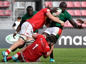 Kenya's full-back Samuel Oliech (R) is tackled by Canada's prop Hubert Buydens during the 2019 Japan Rugby Union World Cup qualifying match between Canada and Kenya at The Delort Stadium in Marseille on November 11, 2018.