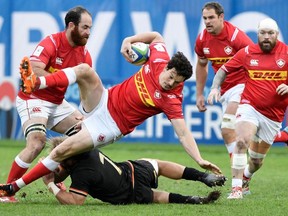 Canada's centre Ciaran Hearn is tackled during the 2019 Japan Rugby Union World Cup qualifying match between Canada and Germany at the Delort Stadium on November 17, 2018 in Marseille, southern France.