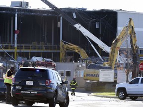 Emergency personnel look over damage, Saturday, Nov. 3, 2018, after a weather-related building collapse at an Amazon distribution warehouse on Baltimore's southeast side Friday night.