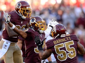 Washington Redskins' David Amerson (centre) celebrates after intercepting a pass from Philip Rivers of the San Diego Chargers (not pictured) in the fourth quarter during an NFL game at FedExField on Nov. 3, 2013 in Landover, Md.