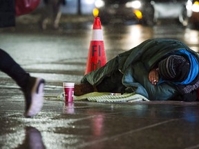 A homeless person is seen in downtown Toronto, on Wednesday, Jan. 3, 2018.