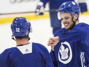 Maple Leafs’ Auston Matthews gives Patrick Marleau the thumbs down during practice on October 26, 2018. (CRAIG ROBERTSON/TORONTO SUN)