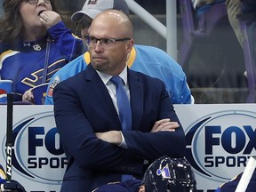 FILE - In this Thursday, Oct. 25, 2018, file photo, St. Louis Blues head coach Mike Yeo watches from the bench during the second period of an NHL hockey game against the Columbus Blue Jackets, in St. Louis. Early Tuesday, Nov. 20, 2018, Blues general manager Doug Armstrong announced that the team has fired Yeo and named Craig Berube as his interim replacement.