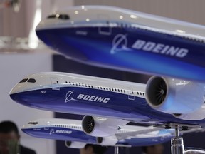 In this Nov. 6, 2018, file photo models of a Boeing passenger airliner are displayed during the 12th China International Aviation and Aerospace Exhibition. (AP Photo/Kin Cheung, File)