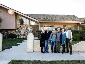 In this Thursday, Nov. 1 2018, photo provided by HGTV,  members of the "The Brady Bunch" cast from left to right, Maureen McCormack, Christopher Knight,  Susan Olsen, Mike Lookinland, Eve Plumb and Barry Williams pose in front of the original Brady home in the Studio City neighborhood in Los Angeles. The cast members gathered Thursday at the home that was featured in the opening and closing of the sitcom. HGTV purchased the home in the Studio City neighborhood in Los Angeles for its new series, "A Very Brady Renovation."  HGTV plans to expand the home without compromising its street view and reimagine the show's interior design.  The program is set to premiere in September 2019.  (Courtesy of HGTV via AP)