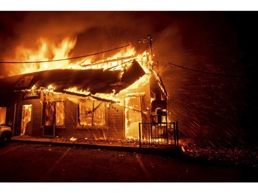 Flames consume The Screen & Window Shop as the Camp Fire tears through Paradise, Calif., on Thursday, Nov. 8, 2018.