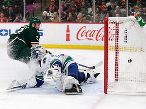 Minnesota Wild centre Charlie Coyle scores a goal on Vancouver Canucks' Richard Bachman during the first period of an NHL game Thursday, Nov. 15, 2018, in St. Paul, Minn.