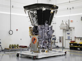 In this July 6, 2018 file photo, NASA's Parker Solar Probe sits in a clean room at Astrotech Space Operations in Titusville, Fla., after the installation of its heat shield.