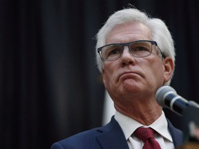 Jim Carr, Minister of International Trade Diversification, announces the federal government's action plan to tackle climate change during a press conference in Winnipeg on Oct. 23, 2018.