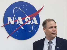 Administrator of the National Aeronautics and Space Administration (NASA) Jim Bridenstine enters the hall before a news conference at the U.S. embassy in Moscow, Russia, Oct. 12, 2018.