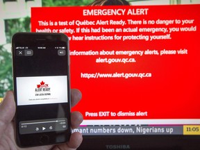 A smartphone and a television receive visual and audio alerts to test Alert Ready, a national public alert system Monday, May 7, 2018 in Montreal. It wasn't perfect but officials say the second test of Canada's new national public-alert system for mobile devices went better than the initial test six months ago. THE CANADIAN PRESS/Ryan Remiorz