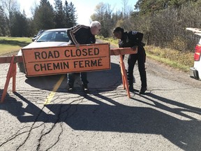 Police have closed a section of McGee Side Road between the 417 and William Mooney Road after a mid-air collision between two planes. and have turned the scene over to investigators from the Transportation Safety Board. (Ashley Fraser/Ottawa Citizen/Postmedia Network)