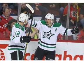 Stars Radek Faksa (L) and Jason Spezza celebrate a first period goal during NHL action between the Dallas Stars and the Calgary Flames in Calgary on Wednesday, November 28, 2018. Jim Wells/Postmedia