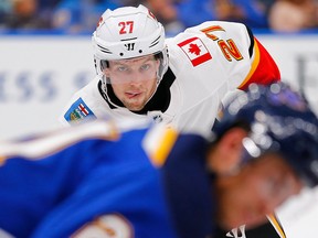Austin Czarnik of the Calgary Flames lines up for a faceoff against the St. Louis Blues at the Enterprise Center on Oct. 11, 2018 in St. Louis, Mo