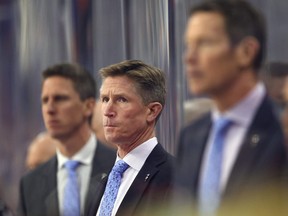 Flyers head coach Dave Hakstol, centre, watches the play during NHL action against the Senators in Philadelphia on Tuesday, Nov. 27, 2018.