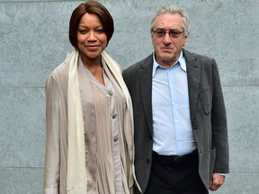 Robert De Niro arrives with his wife Grace Hightower De Niro at the show for fashion house Giorgio Armani at the Men Spring-Summer 2016 Milan's Fashion Week on June 23, 2015.