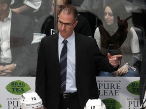 In this March 22, 2018, filer photo, Los Angeles Kings coach John Stevens gestures to his team during the third period against the Colorado Avalanche in an NHL hockey game in Denver. (AP Photo/David Zalubowski, File)