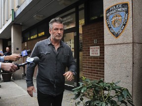 Actor Alec Baldwin walks out of the New York Police Department's 10th Precinct, Friday, Nov. 2, 2018, in New York.