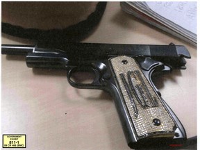 This undated photo provided by the U.S. Attorney's Office shows a diamond-encrusted pistol that a government witness said belonged to infamous Mexican drug lord Joaquin "El Chapo" Guzman, at Guzman's trial in New York, Monday, Nov. 19, 2018.  (U.S. Attorney's Office via AP)