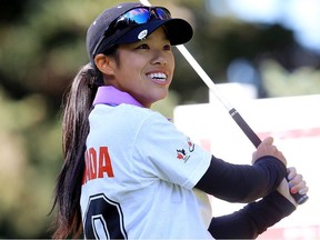 Calgary's Jacyln Lee, 16, tees off on the 11th hole with Lorie Kane's foursome, during the Championship Pro-Am at the 2013 CN Canadian Women's Open, at the Royal Mayfair Golf Club in Edmonton, Alta., Wednesday Aug. 21, 2013.