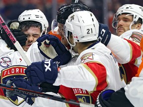 MacKenzie Weegar of the Florida Panthers is grabbed in the face during a game against the Philadelphia Flyers at Wells Fargo Center on November 13, 2018 in Philadelphia. (Patrick Smith/Getty Images)