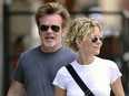 Meg Ryan carries some drinks while out for a stroll in Manhattan with John Mellencamp  on June 24, 2013.