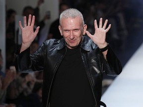 FILE - In this Wednesday, July 4, 2018 file picture French fashion designer Jean-Paul Gaultier accepts applause after his Haute Couture Fall-Winter 2018/2019 fashion collection, in Paris, France. Parisian couturier Jean Paul Gaultier has become the latest fashion designer to shun the use of fur in his designs.