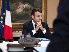 French President Emmanuel Macron chairs a cabinet meeting in Charleville-Mezieres, northeastern France, Wednesday, Nov.7 2018.