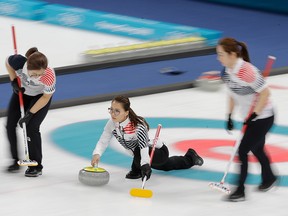 In this Feb. 25, 2018 file photo, Kim Eun-jung, of South Korea, throws during their women's curling final in the Gangneung Curling Centre at the 2018 Winter Olympics in Gangneung, South Korea, Sunday, Feb. 25, 2018.