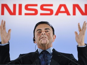 In this file photo taken on May 11, 2012, President and CEO of Japan's auto giant Nissan Carlos Ghosn gestures as he answers questions during a press conference at the headquarters in Yokohama. (Getty Images)