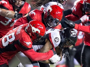 The Calgary Stampeders tackle Ottawa Redblacks wide receiver R.J. Harris (84) from running with the ball during the second half of the 106th Grey Cup in Edmonton, Sunday, Nov. 25, 2018.
