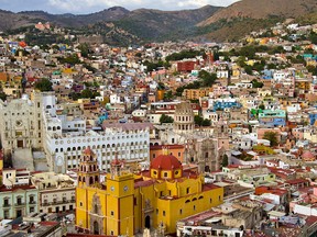 Guanajuato looks like colourful children's blocks strewn haphazardly at the bottom of a valley, spilling up the slopes surrounding it. (Postmedia file photo))