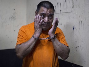 In this Aug. 10, 2016 file photo, Santos Lopez Alonzo stands in a courtroom as he waits for his first hearing in Guatemala City. (AP Photo/Luis Soto, File)