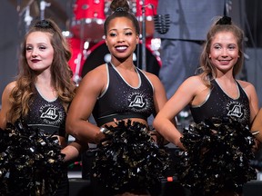 Cheerleaders listen as the Canadian Football League announces that Halifax's CFL team will be called the Atlantic Schooners, during an event at Grey Cup week, in Edmonton, Alta., on Friday November 23, 2018. (THE CANADIAN PRESS/Darryl Dyck)