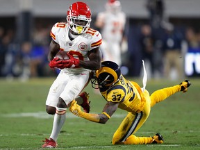 Sam Shields of the Los Angeles Rams falls after Tyreek Hill of the Kansas City Chiefs makes a reception during the second quarter of the game at Los Angeles Memorial Coliseum on Nov. 19, 2018 in Los Angeles.