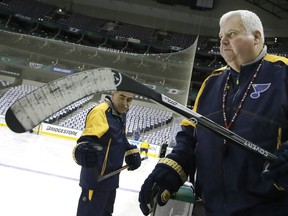 FILE - In this April 30, 2016, file photo, St. Louis Blues head coach Ken Hitchcock takes the ice for practice in preparation of Game 2 of the NHL hockey Stanley Cup Western Conference semifinals, in Dallas. The Edmonton Oilers have fired coach Todd McLellan and replaced him with Ken Hitchcock with the team languishing in sixth place in the Pacific Division. McLellan was in his fourth season behind the Oilers' bench. The team missed the playoffs in two of his previous three seasons despite having superstar Connor McDavid on its roster. The Oilers were just 9-10-1 entering its game Tuesday night, Nov. 20, 2018, at San Jose. (AP Photo/LM Otero, File) ORG XMIT: NY168