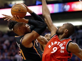 Raptors forward Serge Ibaka blocks a shot by Richaun Holmes of the Phoenix Suns. AP PHOTO