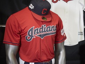 The Cleveland Indians display their 2019 uniforms, including a new home alternate red jersey, Monday morning, Nov. 19, 2018, at the Progressive Field Team Shop in Cleveland, Ohio. (Dan Mendlik/The Cleveland Indians via AP) ORG XMIT: NY176