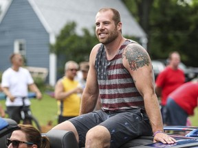 In this July 4, 2018, file photo, Jason Seaman serves as a grand marshal in the Fourth of July Parade in Noblesville, Ind. The seventh-grade science teacher survived a school shooting at Noblesville West Middle School on May 25, 2018.